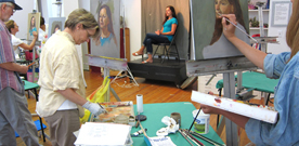 Photo of adult students in a portrait painting class