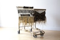 "Appropriation Mud Cloth Baggage Cart," Mud Cloth from Mali, Desert Camo and Gold 850 Paracord and Forget Me Not Raffia on Gold Spray Painted Recovered Shopping Cart, by Theda Sandiford