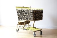 "Hi Yellow Mud Cloth Baggage Cart," Mud Cloth from Mali, Desert Camo and Gold 850 Paracord and Forget Me Not Raffia on Gold Spray Painted Recovered Shopping Cart, by Theda Sandiford